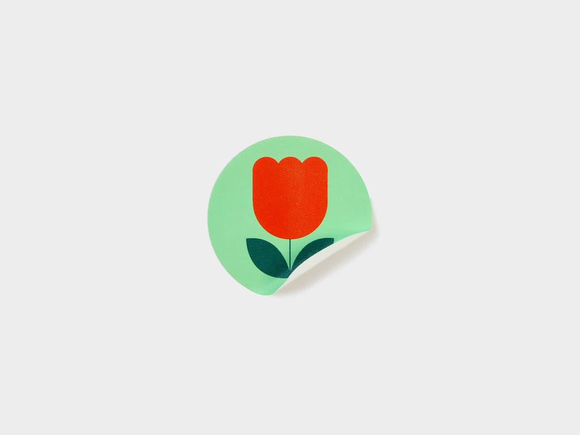 A customized round matte paper sticker in size 2 inch.